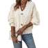 Soft white cable knit cardigan with statement buttons, detailed knitwear close-up