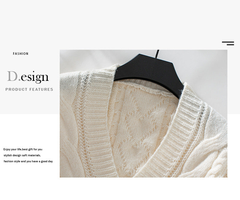 White cardigan detail showing delicate knit pattern and design stitching