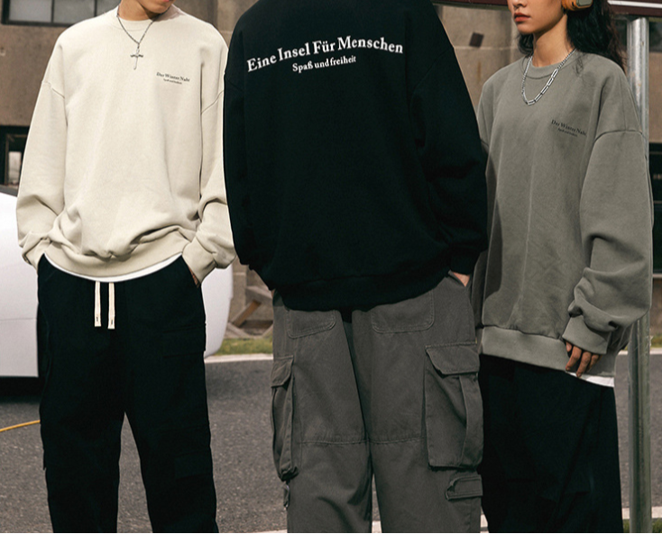 Back view of sweatshirt with full German text 'Eine Insel Für Menschen'