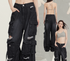 Multiple views of black distressed cargo pants with pocket details on model wearing grey crop top against studio background