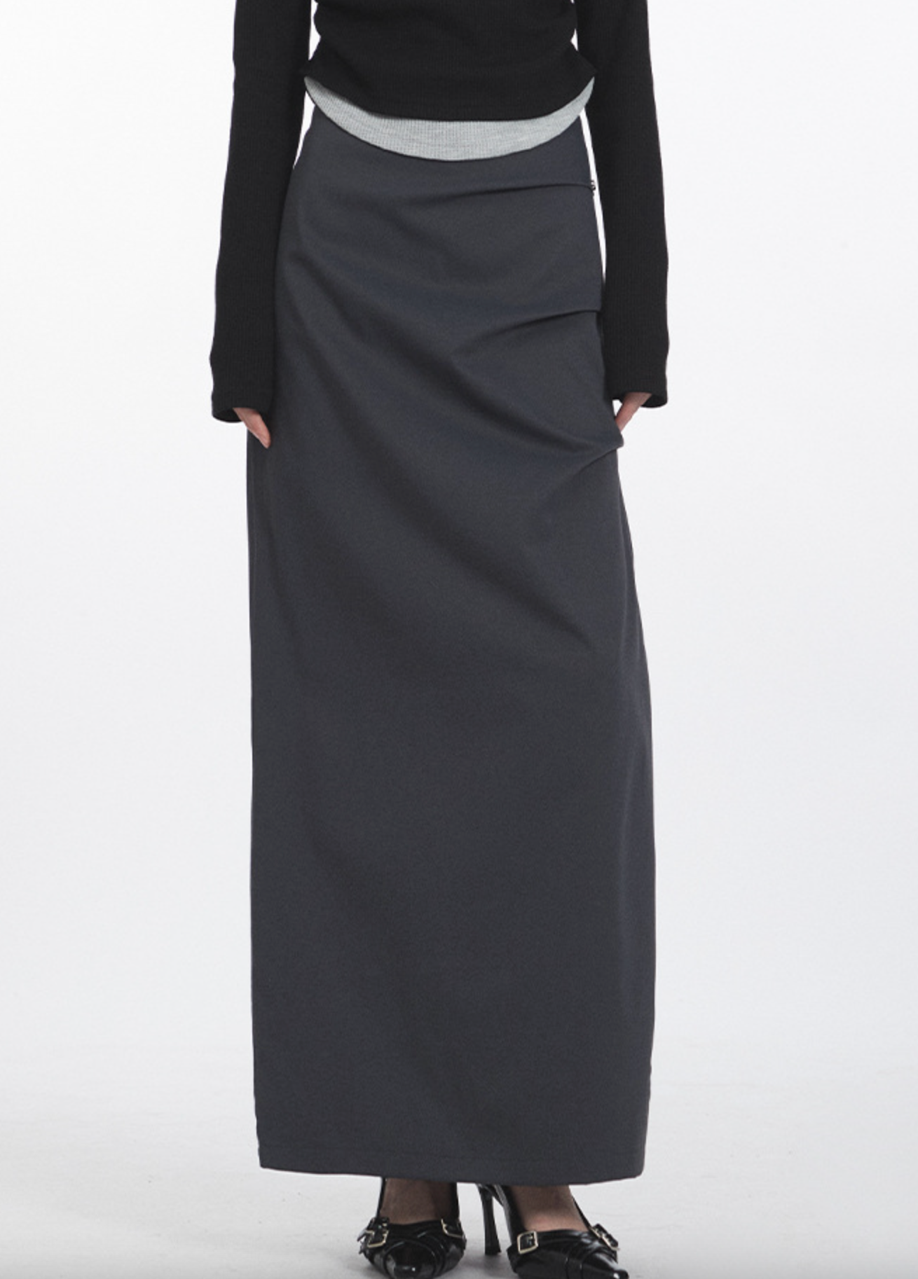 Side view of charcoal gray midi skirt with draped design and elegant layered details