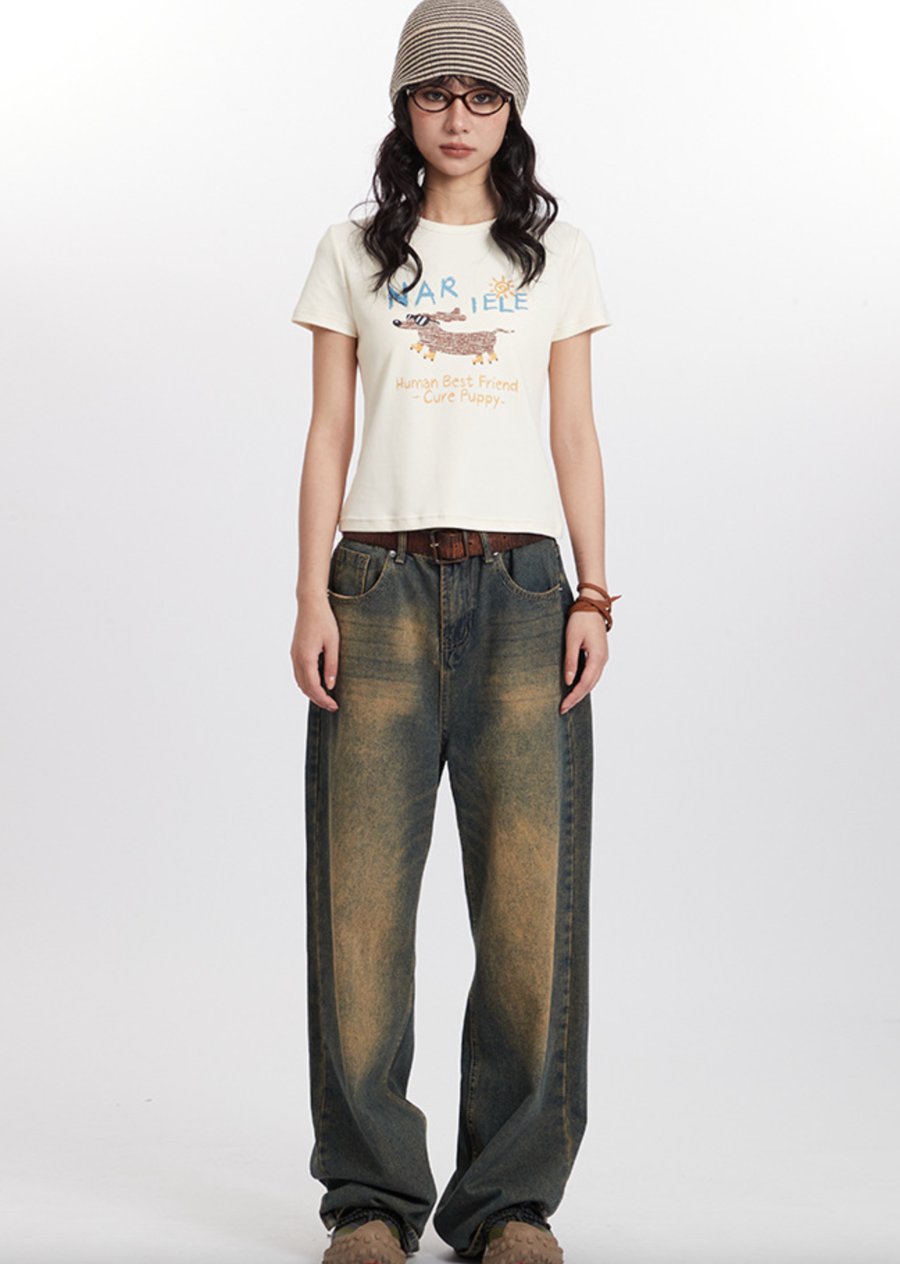 Retro streetwear outfit with striped beanie, graphic puppy tee, wide-leg distressed jeans