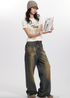 Stylish model reading newspaper, wearing dog graphic tee and loose-fit denim jeans