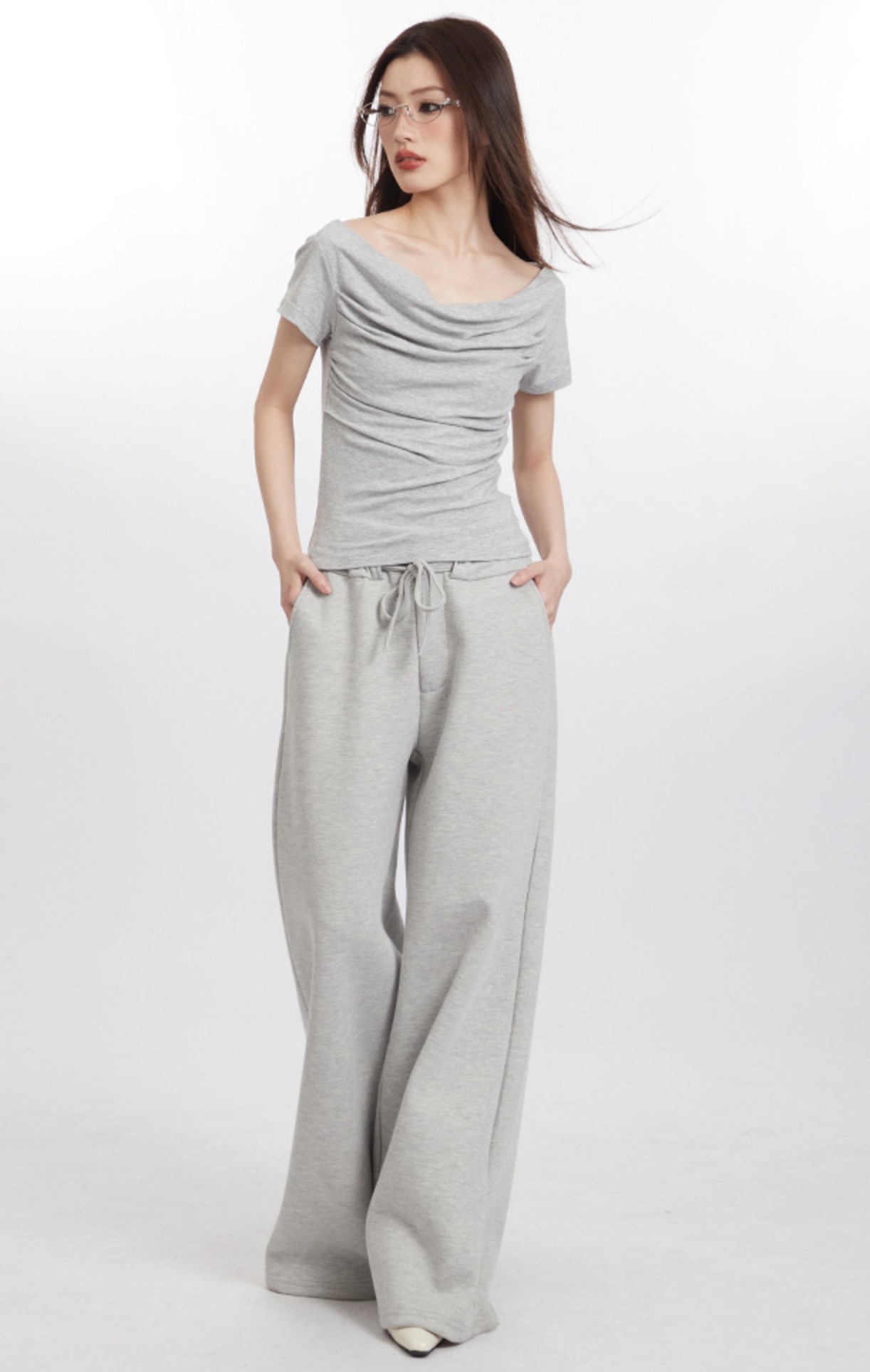 Black draped off-shoulder top with ruched detailing
