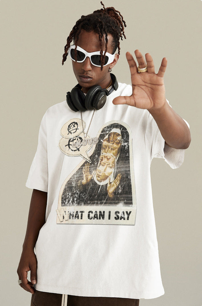 A model wearing white sunglasses and white graphic t-shirt with raised hand gesture. Features black headphones, dreadlocks, and gold ring