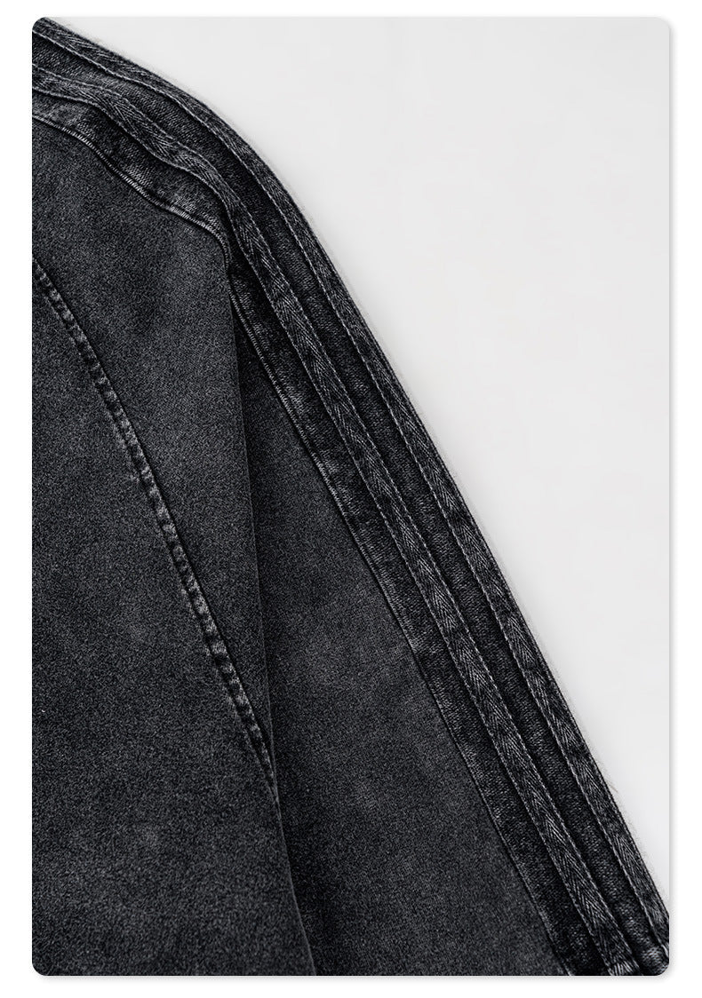 Stitching detail of black sweatshirt sleeve showing multiple parallel seams