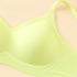 Close-up of a light green bra showcasing seamless cup design with W-shaped support.