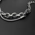 Detailed shot of chain links and snake chain accents on a silver bracelet, highlighting its layered and textured design.