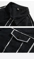 Close-up detail of black denim jacket showing collar and chest pocket with white outline stitching and metal button closure