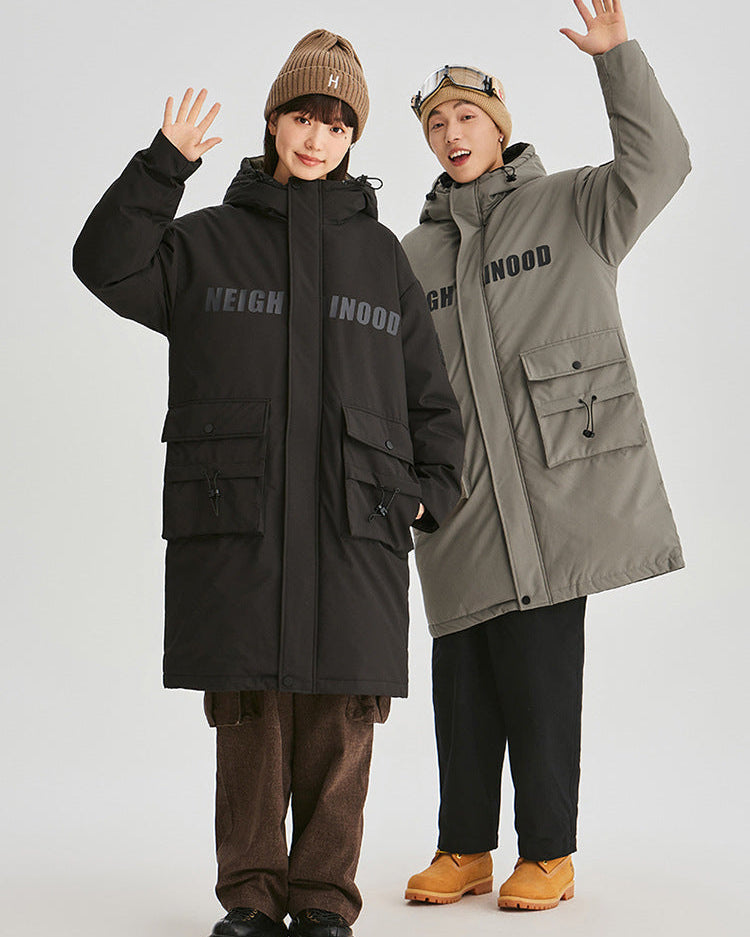 Two models wearing matching NEIGHBORHOOD parkas in black and olive green raise their hands while posing against white background