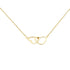 Delicate gold chain necklace with two minimalist heart-shaped pendants, shown against a light background
