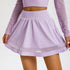 Close-up of soft mist purple skirt showing gathered waist and mesh panel trim detail
