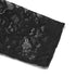 Detailed view of a black lace sleeve with a delicate floral pattern.