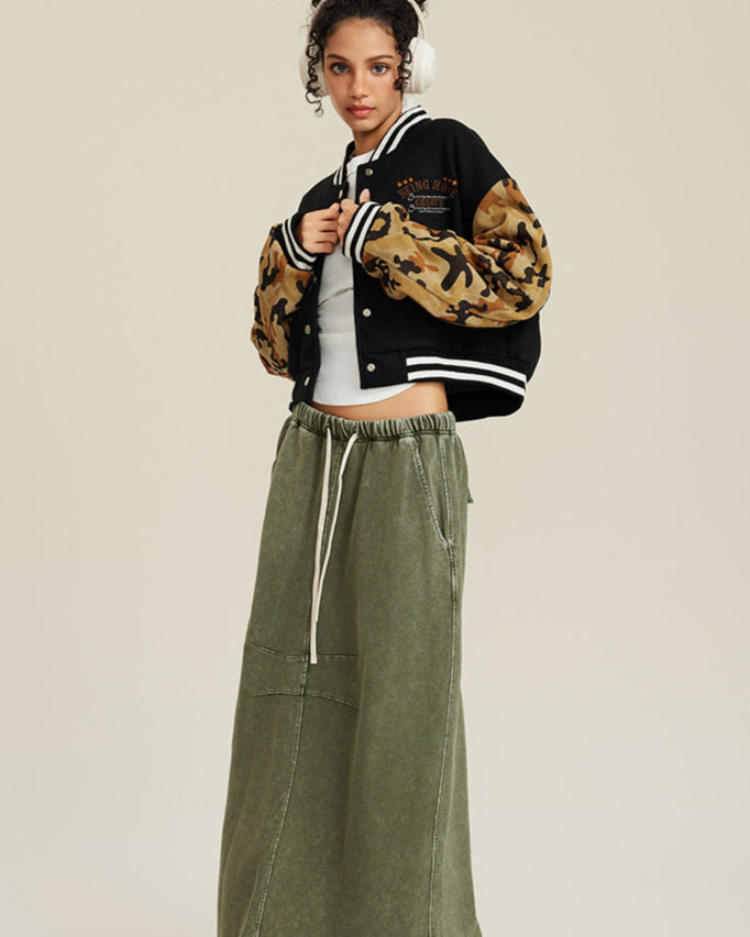 Black and tan camouflage cropped varsity jacket with white striped collar and embroidered chest design
