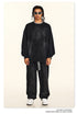 Full-length black brushed cotton sweatsuit styled with sport sunglasses and statement accessories