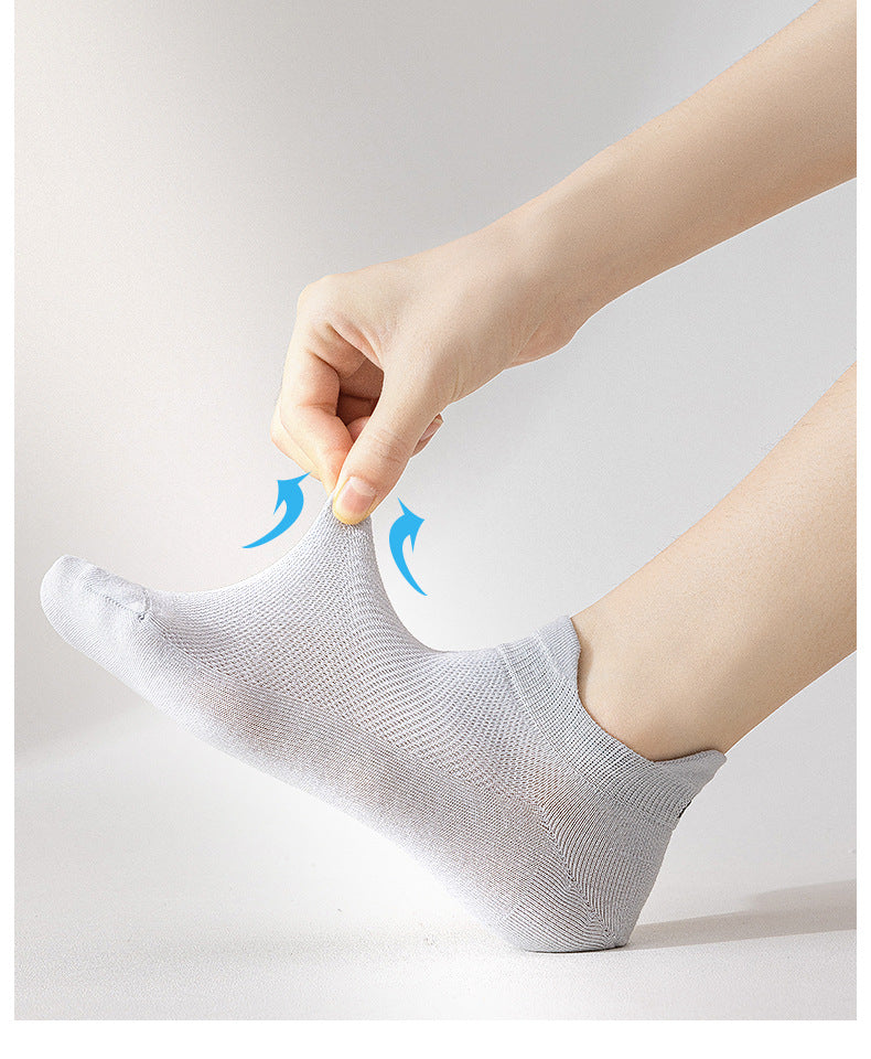 White antibacterial ankle socks with brand label and quality certification tags, retail presentation