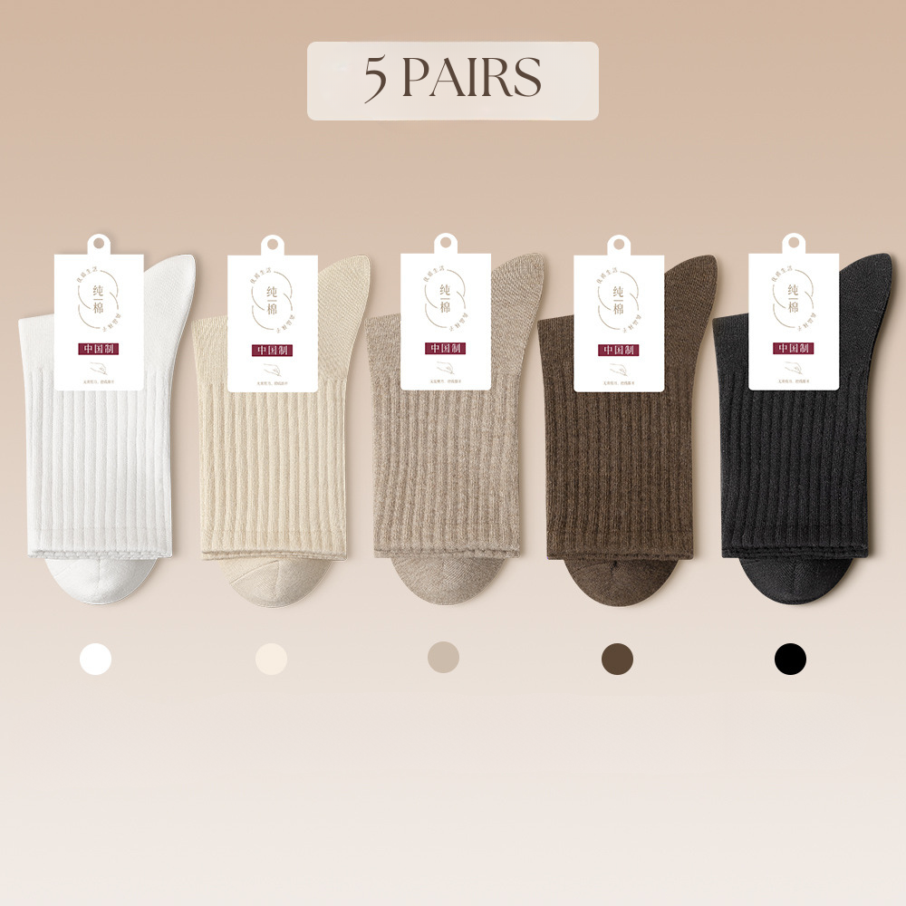 Five-pair sock set in neutral colors from pure white to black, featuring ribbed texture and brand tags