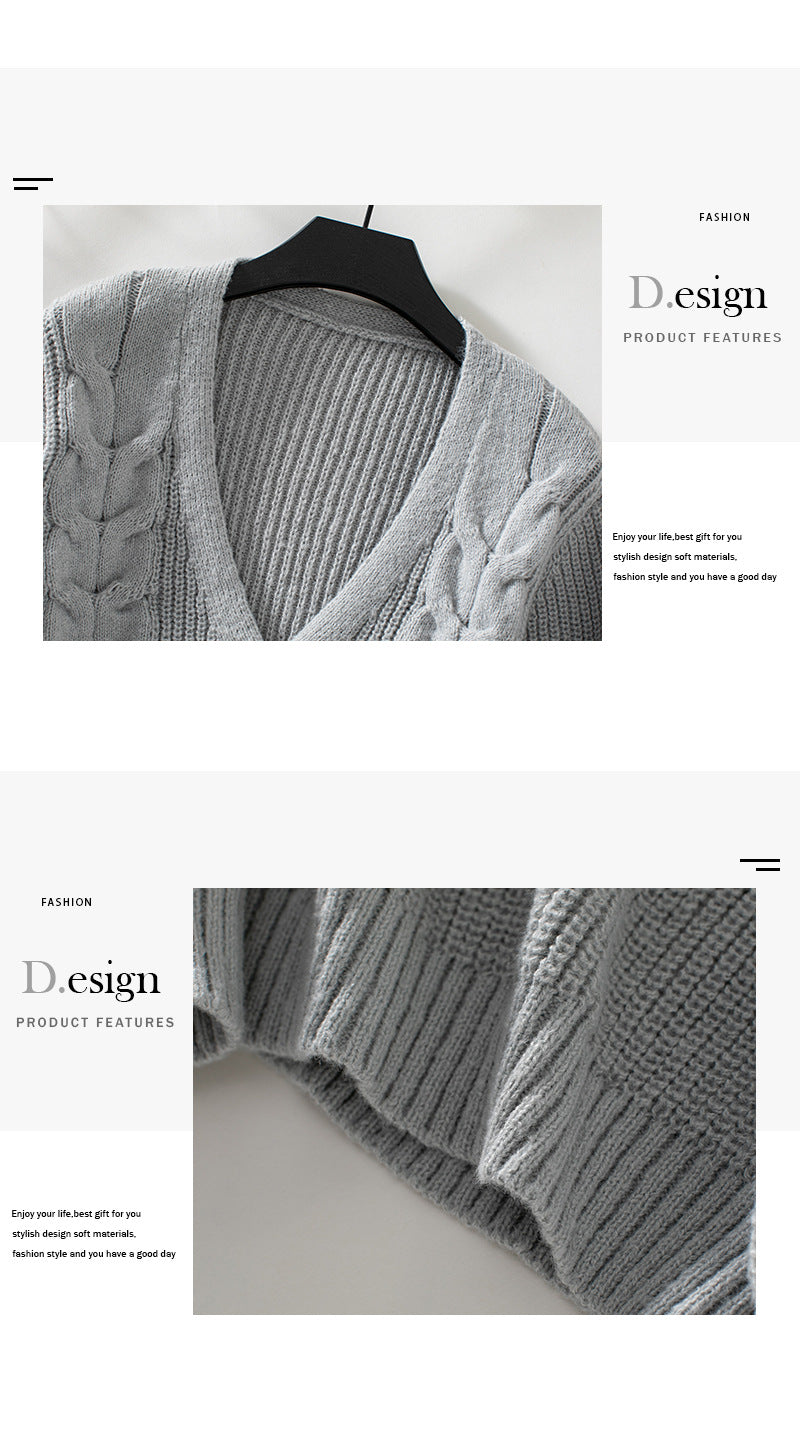 Detailed view of gray knit cardigan back, emphasizing ribbed knit construction and cable pattern design