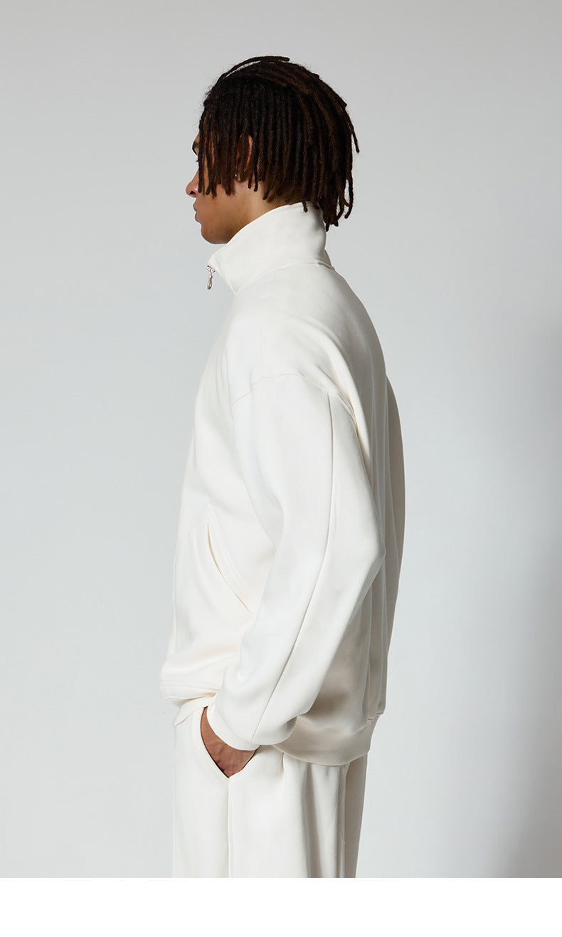 Side profile view of white track jacket showing clean lines and structured collar design
