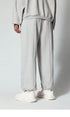 Black sweatpants with elastic waistband, shown laid flat against a white background