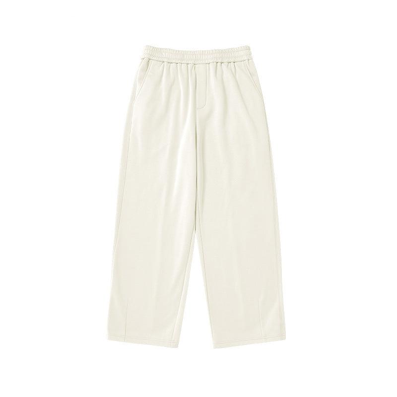 Gray sweatpants featuring a wide elastic waistband and relaxed, straight-leg silhouette