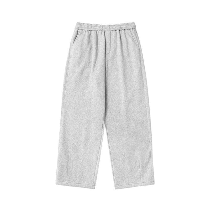 Light gray sweatpants with elastic waist and gathered ankles, showcasing soft fabric texture