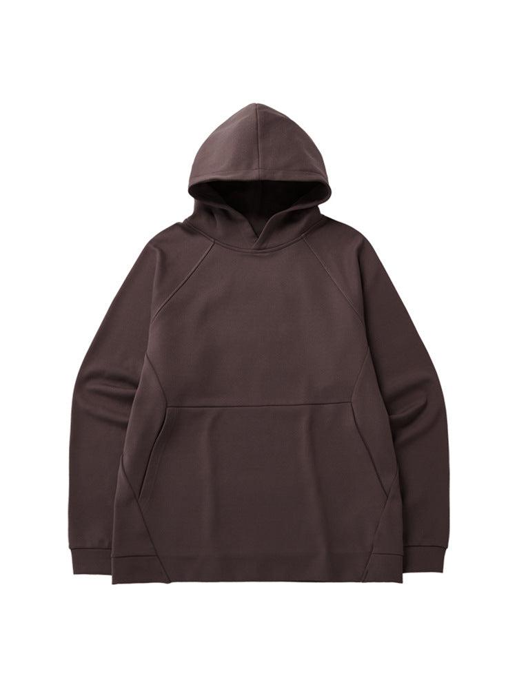 A brown oversized hoodie with raglan sleeves and a front pocket displayed flat against a white background