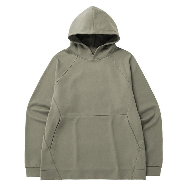 A sage green oversized hoodie with raglan sleeves and a front pocket displayed flat against a white background