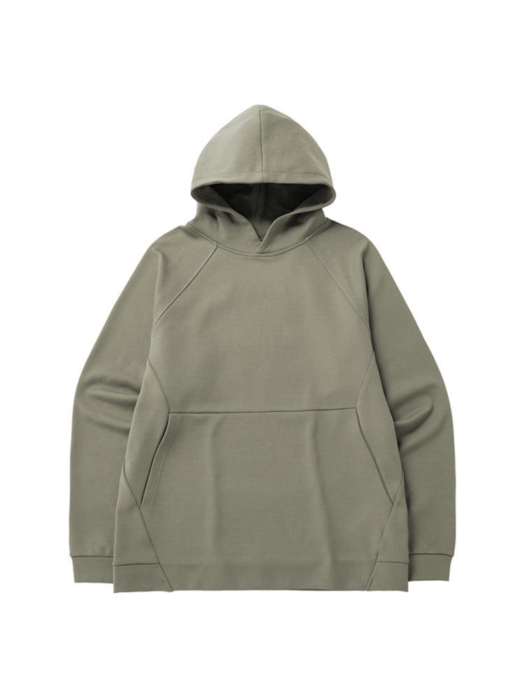 A sage green oversized hoodie with raglan sleeves and a front pocket displayed flat against a white background