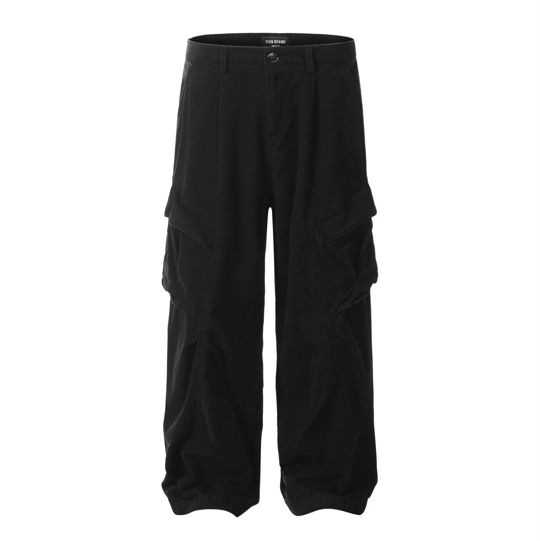 Black wide-leg cargo pants with utility pockets, front pleats, and relaxed fit shown flat against white background