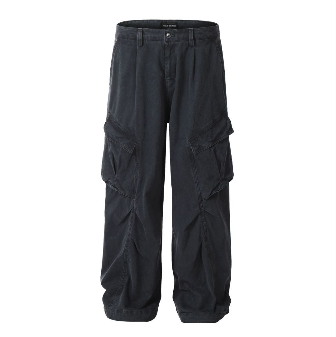 Charcoal gray wide-leg cargo pants featuring angled pocket design and relaxed silhouette on white background