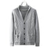 Light gray cable knit cardigan on hanger showing full front view with diamond pattern, patch pockets, and ribbed trim