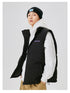 Side view of man wearing black puffer vest with purple NEIGTR STUDIO logo over white hoodie and black beanie against white background