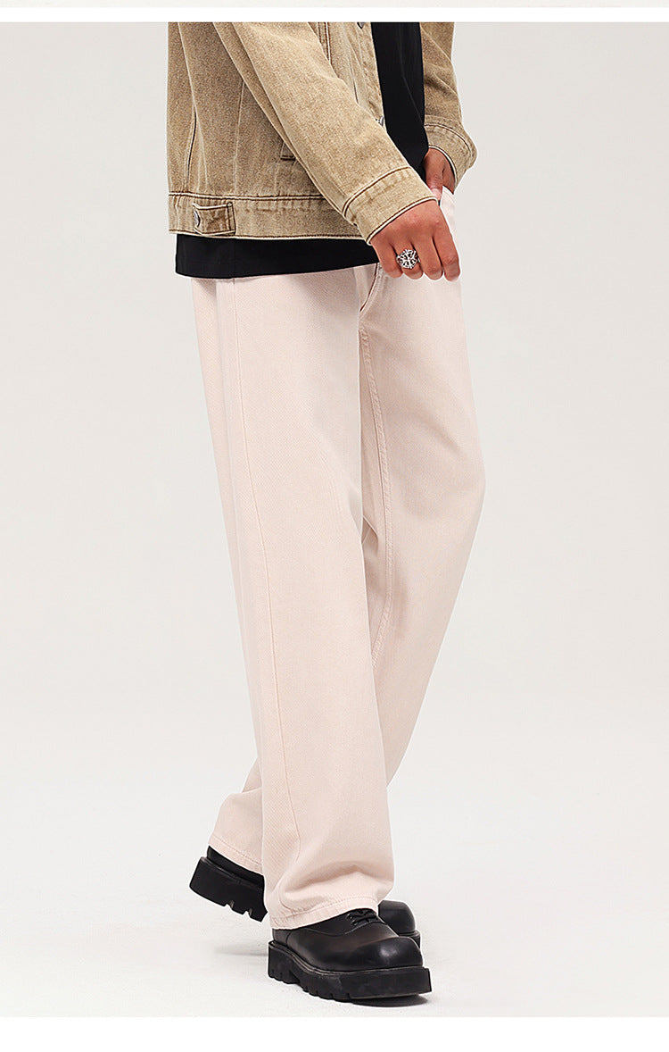 Light beige wide-leg jeans with relaxed fit, styled with dark jacket and chunky black shoes