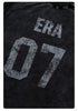 Close-up of distressed 'ERA 07' print detail on black fabric