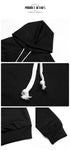 Detailed view of black hoodie dress hood and drawstrings, showing high-quality construction