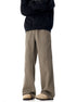 Model wearing olive wide-leg pants with utility pockets, styled with black sweatshirt