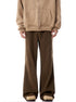 Wide-leg cargo pants in brown with diagonal seams, shown with beige sweatshirt and boots
