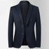 A charcoal gray wool blazer with two-button closure displayed against white background. Clean lines with notched lapel and flap pockets