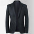 A charcoal two-button blazer displayed open showing inner lining. Tailored silhouette with patch pockets and minimal styling details
