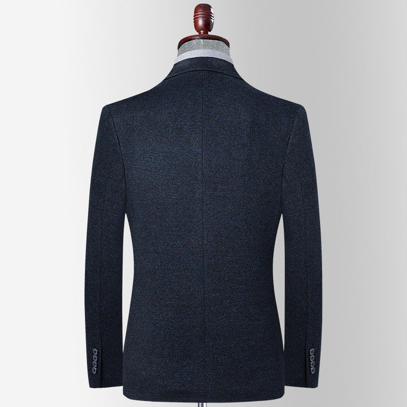 A navy wool blazer shown from back view on mannequin form. Tailored fit with center vent and four-button sleeve detail visible