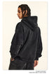 Side profile showing plain black hoodie back and braided hairstyle