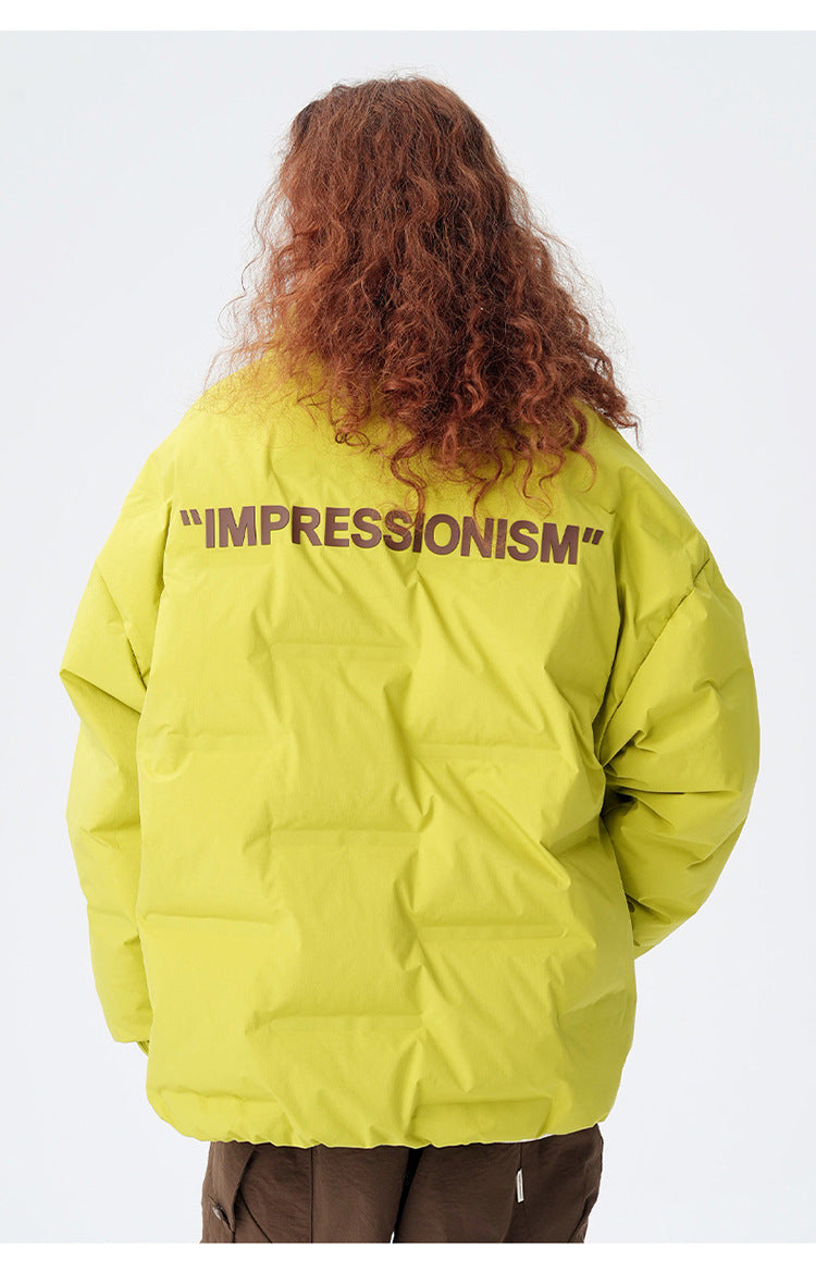 Female model showcasing yellow Impressionism puffer jacket with beige pants