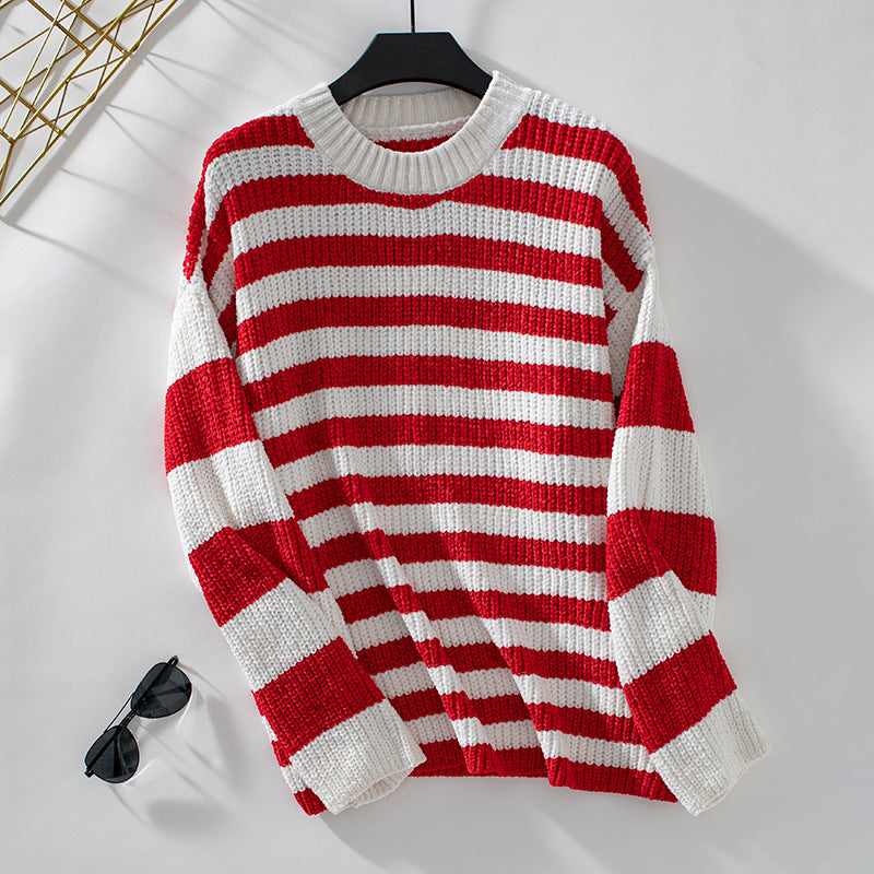 Red and white striped knit sweater on hanger against white background