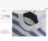 Close-up of blue and white striped sweater showing ribbed neckline