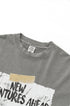Close-up of gray t-shirt collar showing "New Wave" brand label and quality stitching