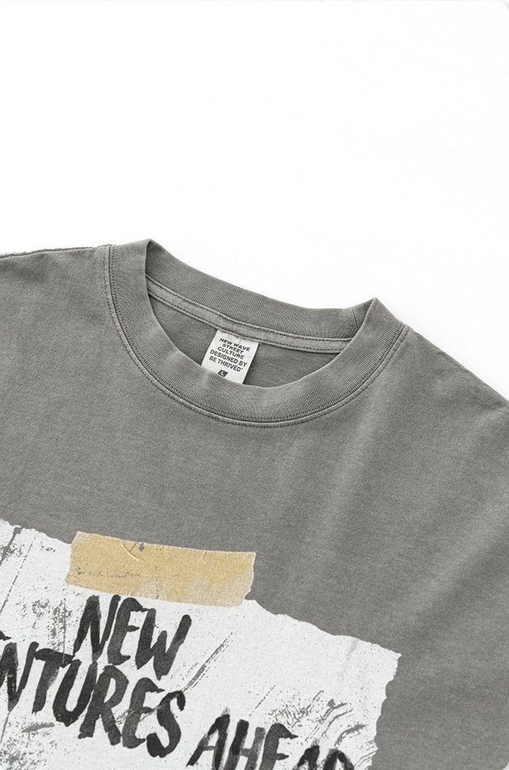 Close-up of gray t-shirt collar showing "New Wave" brand label and quality stitching