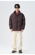 Male model demonstrating brown and black puffer jackets with various styling