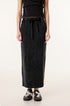 Long black denim skirt with drawstring waist and side pockets, paired with gray and black sneakers with white laces