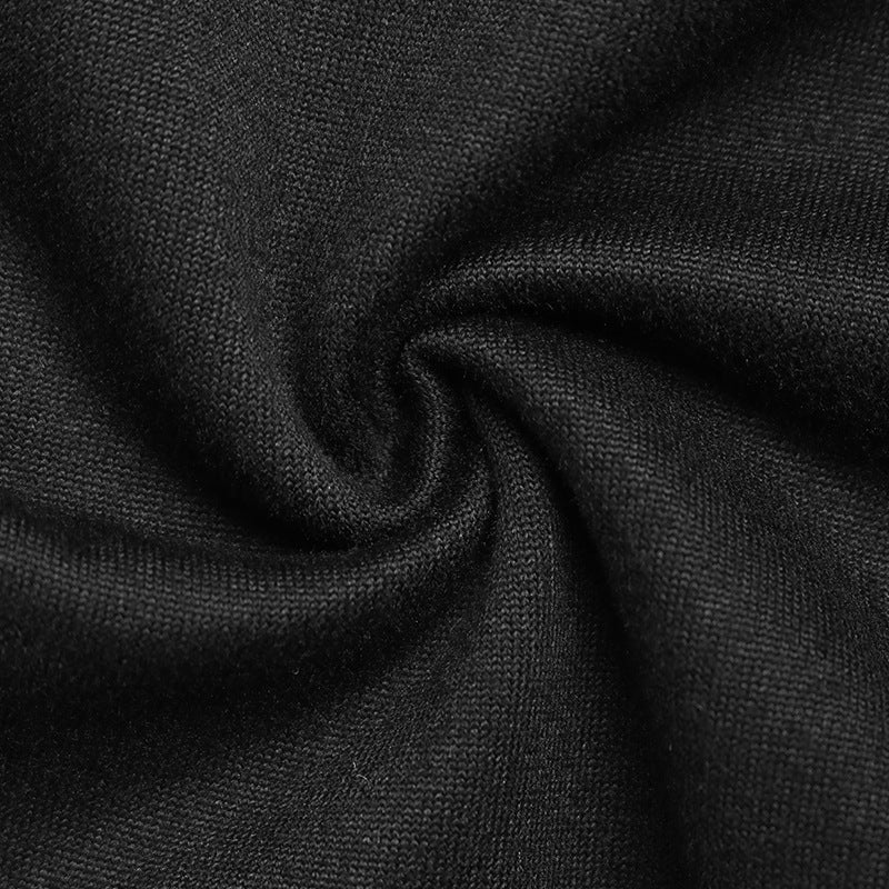 Close-up of black stretch fabric twisted into a swirl.
